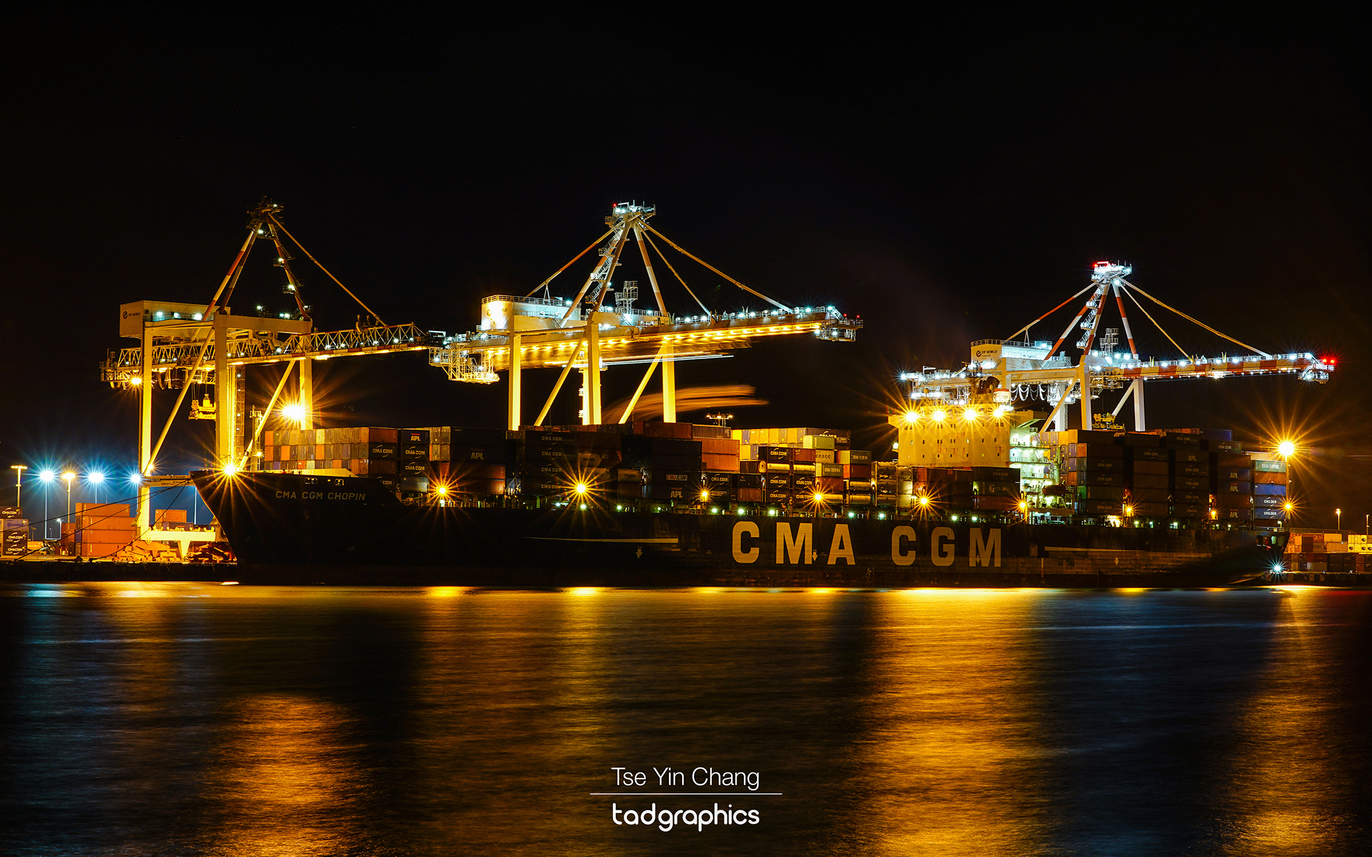 The brightly lit gantry crane at the Fremantle Port