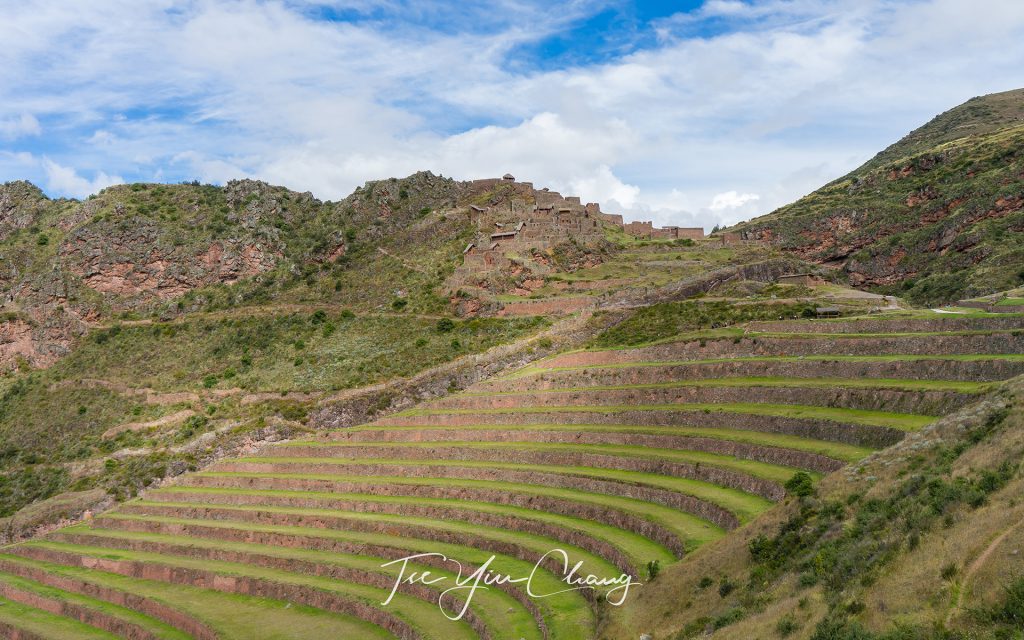 The Inca carved out dramatic terraces from the hillside to be used for agriculture, you can see Intihuatana sun temple at a distance